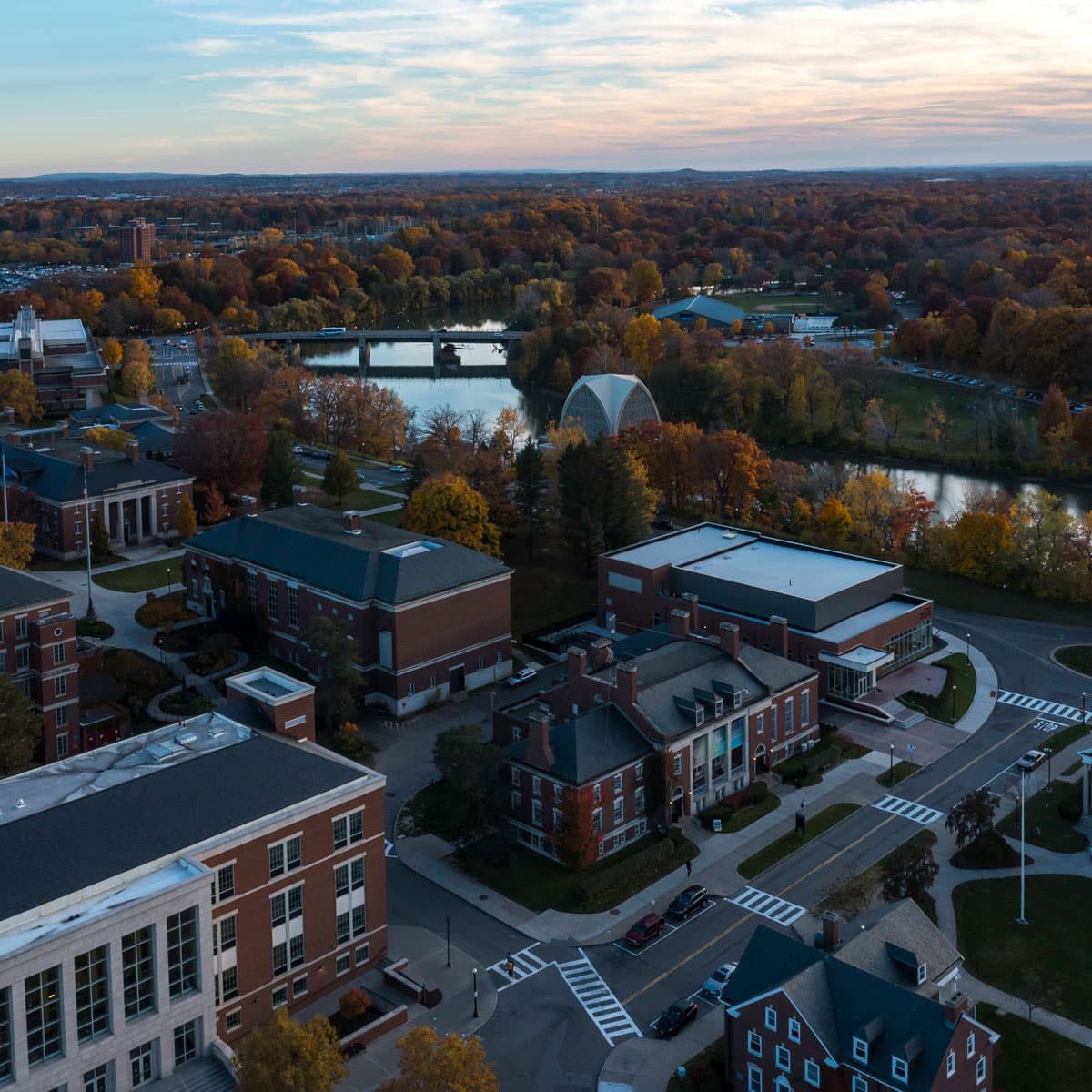 Aerial view of the University of Rochester campus, showcasing the cityscape and surrounding greenery.